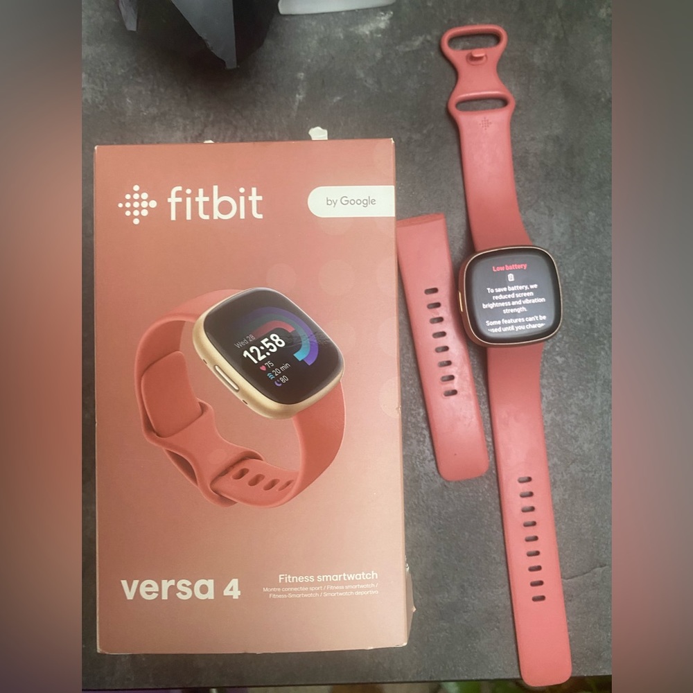 Versa 4 Fitbit Watch Rose /gold color. Comes with box